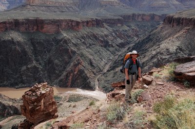 Bill standing at the top of the descent route to Crystal Creek. Slate Canyon is visible across the river.