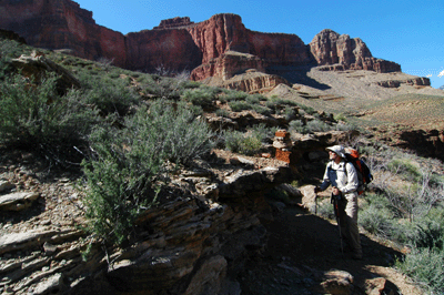 Chris stands at the cairned junction with Tonto Trail West