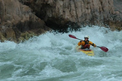 Kayaker running Granite Rapids