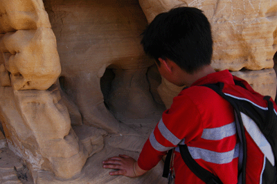 Examining the water-molded Coconino sandstone during a break