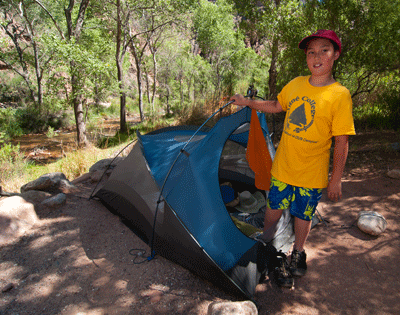 Matthew stands next to our tent in Bright Angel Campground