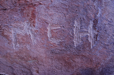 Initials carved into the rock at the Rusty C, our first campsite