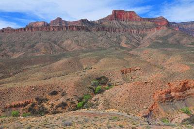 A view of the Still Spring in Lava Creek Canyon with Jupiter Temple (top center left) and several unnamed buttes gracing the horizon