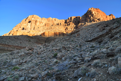 Sunrise paints the Redwall south of Hall Butte