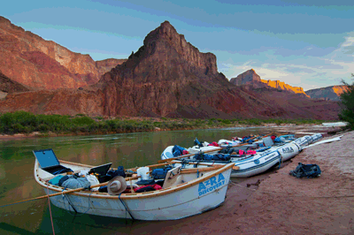 AZRA boats rest peacefully at Lava beach as sunset deepens the shadows over Grand Canyon