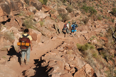 Backpackers traversing the Supai below O'Neill Butte