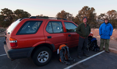 Dennis and Bill stand next to the Isuzu Rodeo in Lipan Point parkinglot