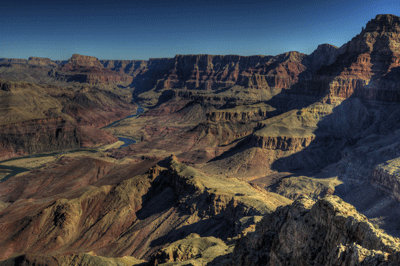 An HDR image of the Colorado River winding around Tanner Rapids with Palisades of the Desert and Comanche Point off to the east