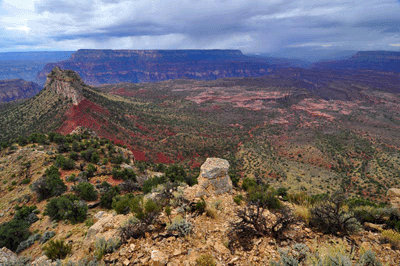 Bridgers Knoll (left) anchors this photo of cloudy skies blanketing the Esplanade in Grand Canyon