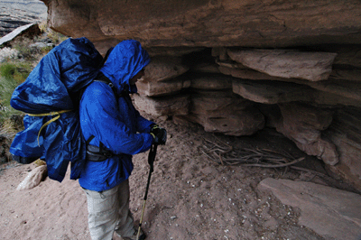 Inspecting a sheltered spot in the Tapeats on the ascent route from Trinity