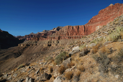Looking ahead at the descent route into Trinity Creek Canyon below Isis Temple