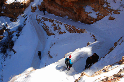 Hikers make their way down the icy upper section of the South Kaibab trail